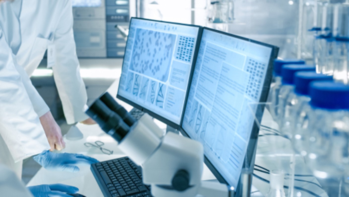 Two computer monitors are shown on a desk.