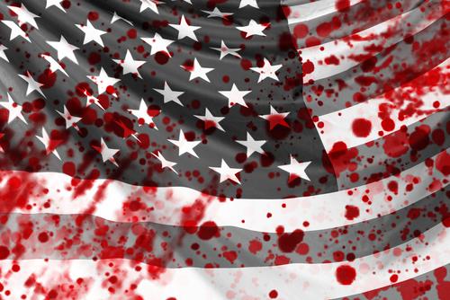 A close up of the american flag with blood spatters.