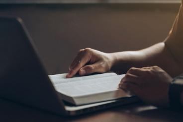 A person is using a laptop on the table