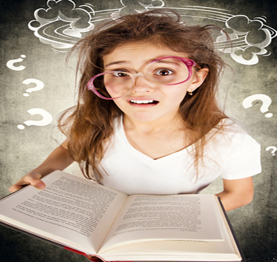 A girl with glasses is holding an open book