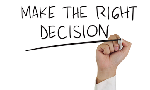 A hand writing " make the right decision ".