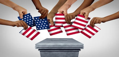 A group of people holding american flags over a ballot box.